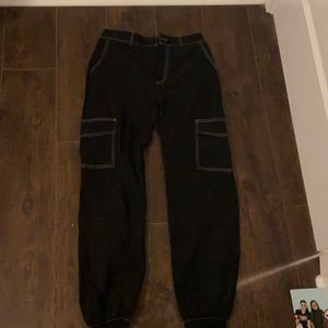 Black cargo pants with white stitching
